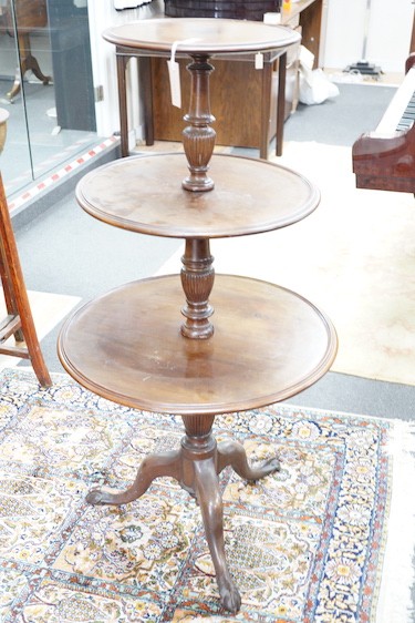A George III style circular mahogany three tier dumb waiter